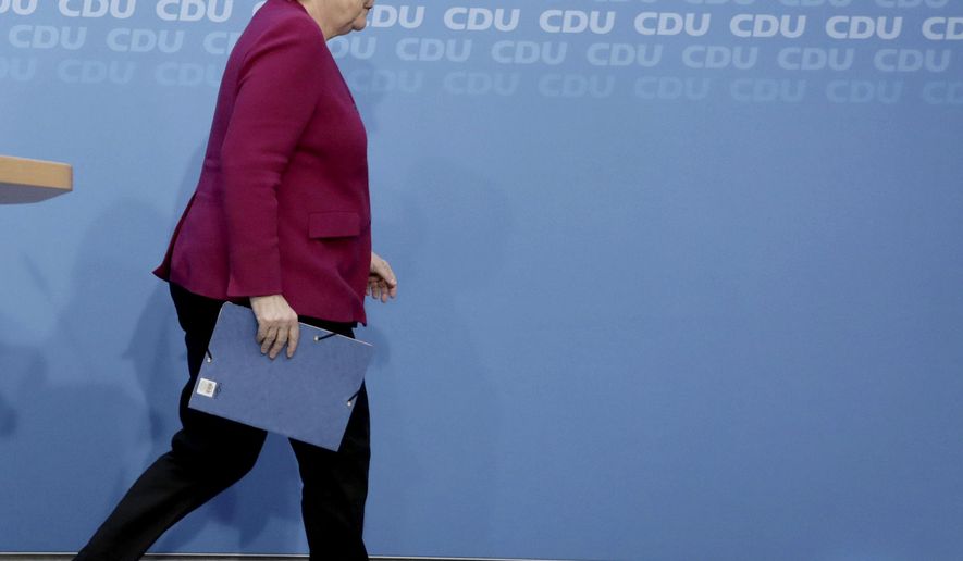 German Christian Democratic Party, CDU, chairwoman and Chancellor Angela Merkel leaves leave after a news conference after a party&#x27;s leaders meeting at the headquarters the in Berlin, Germany, Monday, Oct. 29, 2018. (Kay Nietfeld/dpa via AP)