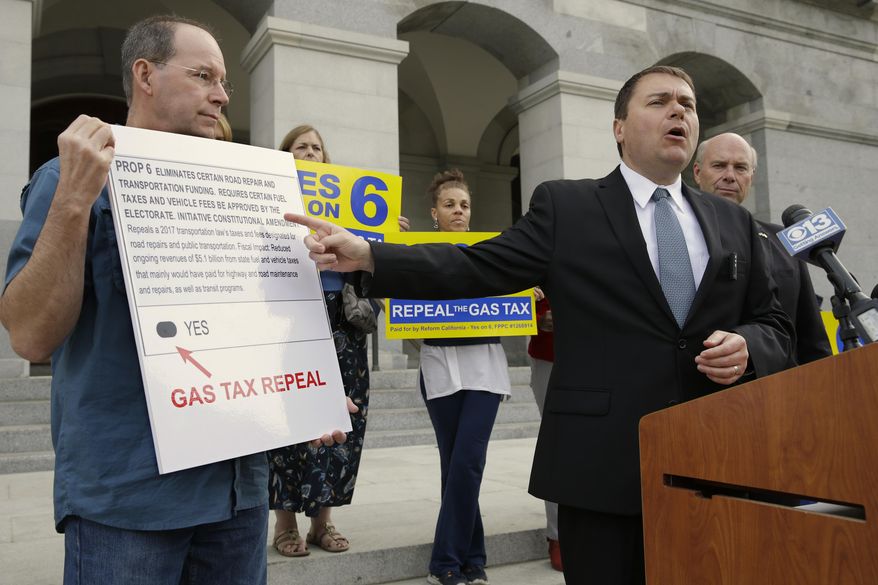 Carl DeMaio, who is leading the Proposition 6 campaign to repeal a recent gas tax increase, gestures towards a mockup of a ballot calling for voters to approve Prop. 6 on the November ballot, during a new conference Monday, Oct. 29, 2018, in Sacramento, Calif. DeMaio says that if the bid fails he&#39;ll seek to recall Democratic Attorney General Xavier Becerra saying Becerra wrote a deceiving ballot title. (AP Photo/Rich Pedroncelli)