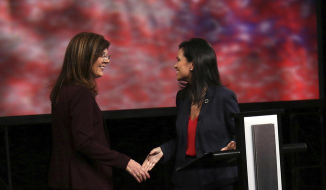 State Rep. Mandy Powers Norrell, D-Lancaster, right, and Republican Upstate businesswoman Pamela Evette give their opening statements during the lieutenant governor&#x27;s debate at South Carolina ETV studios in Columbia, S.C., Monday, Oct. 29, 2018. The women seeking to become South Carolina&#x27;s next lieutenant governor met in their only debate Monday, giving voters a chance to compare the ways in which they envision leading the newly-redesigned office. (Gavin Jackson/SCETV via AP, Pool)