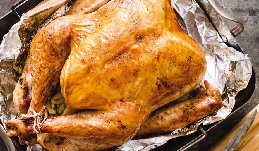 This undated photo provided by America's Test Kitchen in October 2018 shows a roast turkey in Brookline, Mass. This recipe appears in the cookbook “ATB Holiday Entertaining.” (Daniel J. van Ackere/America's Test Kitchen via AP)