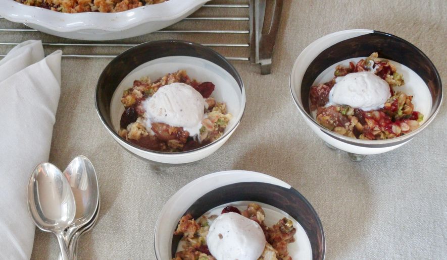 This Oct. 25, 2018 photo shows bowls of grape and cranberry crisps in New York. This dish is from a recipe by Sara Moulton. (Sara Moulton via AP)