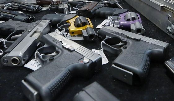 In this Jan. 26, 2013, photo, handguns are displayed on a vendor&#39;s table at an annual gun show in Albany, N.Y. In a study looking at data from 2006-14, serious gun injuries including many from assaults sent 75,000 U.S. children and teens to emergency rooms over the nine years. Results were released on Monday, Oct. 29, 2018. (AP Photo/Philip Kamrass) **FILE**