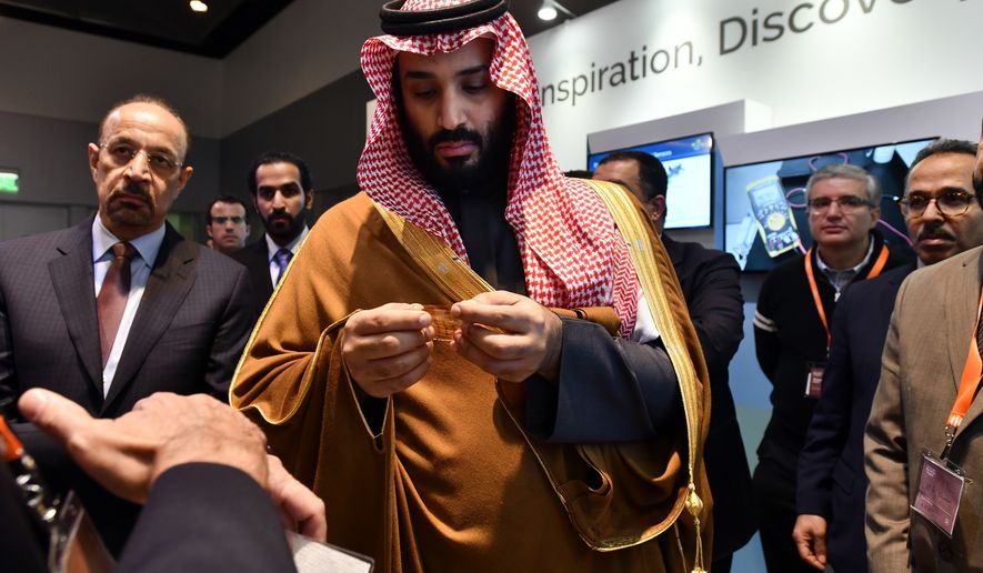In this March 24, 2018, photo, Saudi Arabia Crown Prince Mohammed bin Salman tours an innovation gallery of Saudi Arabian technology, including an exhibit by King Abdullah University of Science and Technology, during a visit to Massachusetts Institute of Technology in Cambridge, Mass. While some U.S. colleges rethink their ties to Saudi Arabia, many more have shown no signs of backing away. An Associated Press analysis of federal data finds that 38 schools received at least $359 million from the Saudi government from 2011 through 2017.  (Josh Reynolds/AP Images for KAUST)