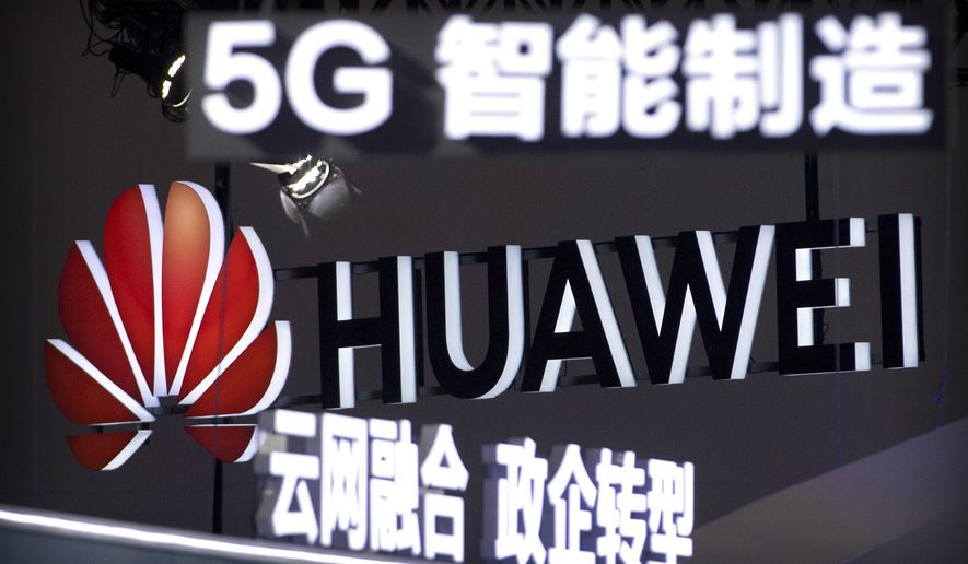 In this Sept. 26, 2018, photo, signs promoting 5G wireless technology from Chinese technology firm Huawei are displayed at the PT Expo in Beijing. A spy chief said in a speech released Tuesday, Oct. 30, 2018, that Australia&#39;s critical infrastructure including electricity grids, water supplies and hospitals could not have been adequately safeguarded if Chinese-owned telecommunications giants Huawei and ZTE Corp. had been allowed to become involved in rolling out the nation&#39;s 5G network. (AP Photo/Mark Schiefelbein)