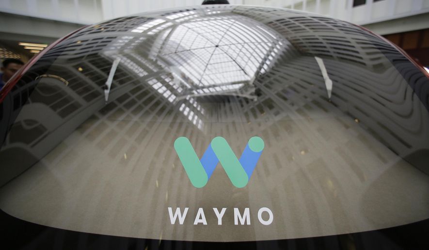 In this Dec. 13, 2016, file photo, a skylight is reflected in the rear window of a Waymo driverless car during a Google event in San Francisco. (AP Photo/Eric Risberg, File)