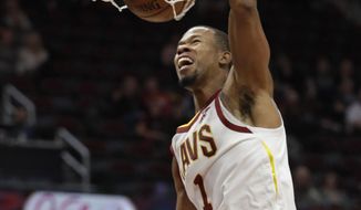 Cleveland Cavaliers&#39; Rodney Hood dunks the ball against the Atlanta Hawks in the first half of an NBA basketball game, Tuesday, Oct. 30, 2018, in Cleveland. (AP Photo/Tony Dejak)