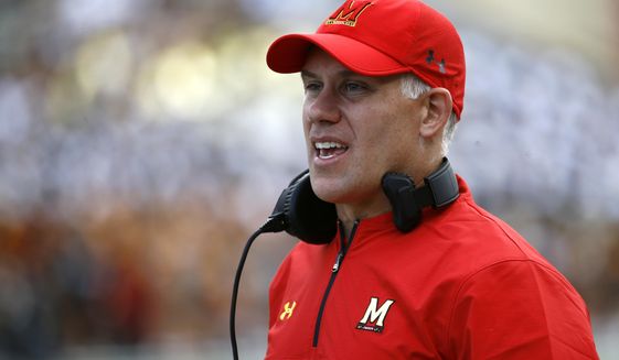 Maryland head coach DJ Durkin stands on the sideline during an NCAA college football game against Towson in College Park, Md. The University System of Maryland&#39;s board of regents announced Tuesday their recommendation that Durkin retain his job. Durkin has been on paid administrative leave since August, following the death of a player who collapsed during practice and an investigation of bullying by the Maryland coaching staff. (AP Photo/Patrick Semansky) ** FILE **