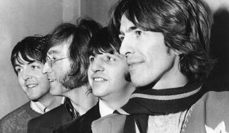 FILE - This Feb. 28, 1968 file photo shows The Beatles, from left, Paul McCartney, John Lennon, Ringo Starr and George Harrison. The Beatles have released a new music video on Apple Music for their 1968 song, “Glass Onion.” The video was released Tuesday and features rare photos and performance footage. The song appeared on their self-titled ninth album, often referred to as the “White Album,” which celebrates its 50th anniversary this year. (AP Photo, File)