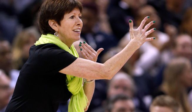FILE - In this Sunday, April 1, 2018 file photo, Notre Dame head coach Muffet McGraw is seen on the sidelines during the first half against Mississippi State in the final of the women's NCAA Final Four college basketball tournament in Columbus, Ohio. It’s been a busy few months for Muffet McGraw and her Notre Dame Fighting Irish after they won the national championship in April on a last-second shot by Arike Ogunbowale. There were award ceremonies, a trip to the ESPYs and Ogunbowale’s appearance on “Dancing with the Stars”. Now with the season beginning in a little over a week, the Irish are focused on the new task at hand and not concerned with defending the title. (AP Photo/Ron Schwane, File)
