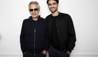 In this Oct. 26, 2018 photo, Andrea Bocelli and his son Matteo Bocelli pose for a portrait in New York to promote the album “Si,” a collection of duets, including their father and son song, &amp;quot;Fall On Me.&amp;quot; (Photo by Taylor Jewell/Invision/AP)