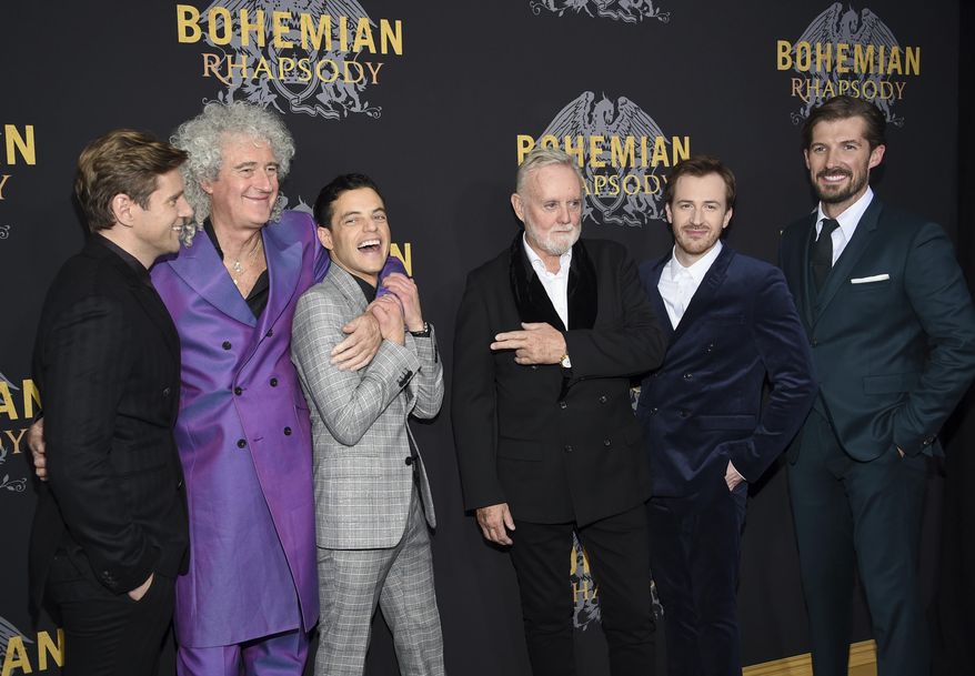 Actor Allen Leech, left, musician Brian May, actor Rami Malek, musician Roger Taylor, actor Joe Mazzello and actor Gwilym Lee pose together at the premiere of "Bohemian Rhapsody" at The Paris Theatre on Tuesday, Oct. 30, 2018, in New York. (Photo by Evan Agostini/Invision/AP)
