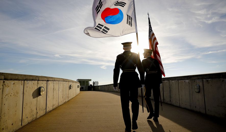 Members of the Honor Guard carry U.S. and South Korea flags after participating in the 2018 Security Consultative at the Pentagon, co-hosted by Defense Secretary Jim Mattis and South Korea Minister of Defense Jeong Kyeong-doo, Wednesday, Oct. 31, 2018. (AP Photo/Pablo Martinez Monsivais)