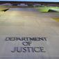 In this May 14, 2013, photo, the Department of Justice headquarters building in Washington is photographed early in the morning. (Associated Press) **FILE**