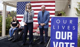 In this Oct. 2, 2018 photo, former Rep. Gabby Giffords speaks as her husband, retired NASA astronaut and Navy Capt. Mark Kelly looks on as they kick off &amp;quot;The Vote Save Lives&amp;quot; tour at UNLV in Las Vegas.  The 2018 election marks the first time that groups supporting gun control measures could spend more on a campaign than the National Rifle Association.  (Bizuayehu Tesfaye/Las Vegas Review-Journal via AP)/Las Vegas Review-Journal via AP)