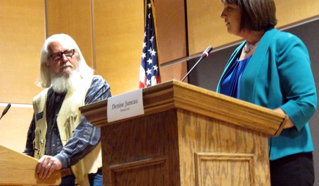 In this Oct. 5, 2016, photo, Libertarian Party candidate Rick Breckenridge, left, looks on during a debate with Democratic U.S. House candidate Denise Juneau in Great Falls, Montana. Breckenridge, who is running for U.S. Senate this year, endorsed Republican candidate Matt Rosendale in his race in response to an anonymous mailer that seeks to undermine conservative support of Rosendale. Rosendale is in a tight race against two-term Democratic Sen. Jon Tester. The mailer is reminiscent of tactics used by Democratic-friendly groups in Tester&#x27;s 2012 race to promote the Libertarian candidate and peel away Republican voters. (AP Photo/Matt Volz)