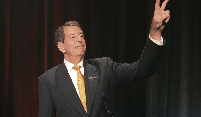 FILE - In this Oct. 23, 2018, file photo, Libertarian candidate for Georgia Governor Ted Metz gestures before a debate in Atlanta. Metz may not get many votes for Georgia governor on Election Day. But the Libertarian candidate is on the ballot, raising the chance that nobody else will win an outright victory next week either. (AP Photo/John Bazemore, Pool, File)