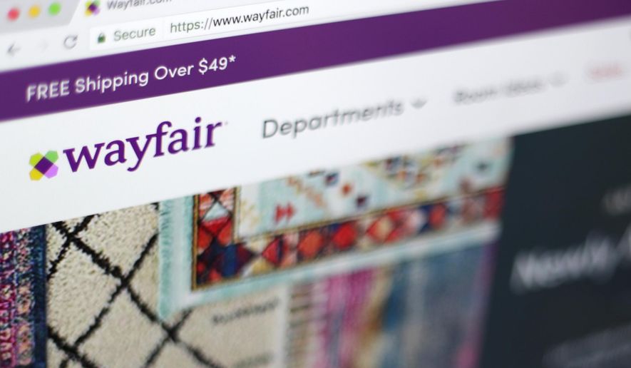 FILE- This April 17, 2018, file photo shows the Wayfair website on a computer in New York. Several sites have made it more affordable to get design help without anyone ever stepping inside your home. Havenly, Wayfair and others are charging less than $100 a room to connect users with an interior designer who can pick out a sofa, show you how to rearrange furniture or offer other design help. (AP Photo/Jenny Kane, File)
