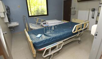 This Aug. 25, 2018, photo shows beds and other equipment being assembled in an ICU room in the Lee County Medical Center in Pennington Gap, Va. Virginia&#39;s westernmost county had appeared to be on track to reopen its only hospital, a rare accomplishment a rural community anywhere in the country. But questions involving the company expected to run the Lee County facility have thrown the plan into question at the last minute. (AP Photo/Earl Neikirk)