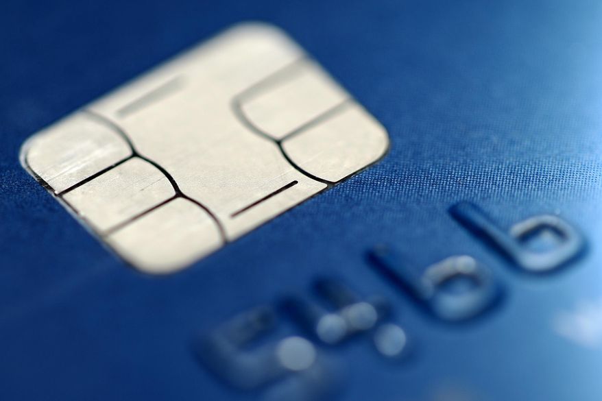 FILE- This June 10, 2015, file photo shows a chip credit card in Philadelphia. Banks, particularly online institutions, have been getting more competitive with the rates they are offering on savings, CDs and even checking accounts to draw more customers. That means a savvy consumer may be able to earn far beyond the norm if they are willing to shop around. (AP Photo/Matt Rourke, File)