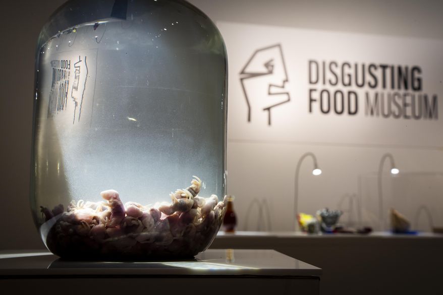 In this photo taken on Sept. 22, 2018 a container of Mice wine on display at the Disgusting Food Museum, in Malmo, Sweden. Baby mice are drowned and brewed in rice wine and the brew is matured for up to a year before drinking. Dozen of foods likely to provoke extreme disgust in many people _ but considered palatable, even precious delicacies, in their home cultures _ go on display Wednesday, Oct. 31, 2018 as the Disgusting Food Museum makes its world premiere in Malmo, Sweden. (Anja Barte Telin via AP)
