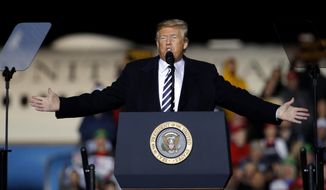 President Donald Trump addresses the crowd during a campaign rally Thursday, Nov. 1, 2018, in Columbia, Mo. (AP Photo/Charlie Riedel)