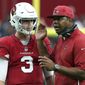 FILE - In this Sept. 23, 2018, file photo, Arizona Cardinals quarterback Josh Rosen (3) talks with quarterbacks coach Byron Leftwich during the second half of an NFL football game against the Chicago Bears in Glendale, Ariz. Leftwich was recently promoted to offensive coordinator, the fifth coordinator that Rosen has had in the past five seasons. (AP Photo/Ralph Freso, File)