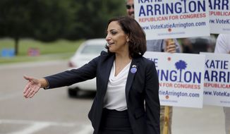 In this June 12, 2018 photo, state Rep. Katie Arrington, who is running for the 1st Congressional District, greets primary voters at the Daniel Island School in Charleston, S.C. Arrington, a Republican who survived a serious car crash just days after the June Republican primary where she defeated U.S. Rep. Mark Sanford, is running against Democrat Joe Cunningham. (Grace Beahm Alford/The Post And Courier via AP)
