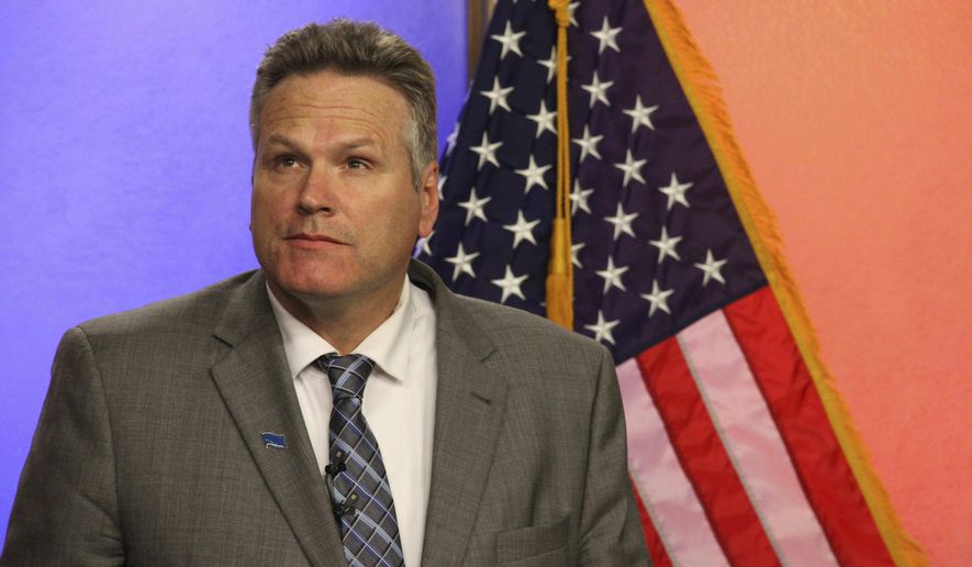 FILE - In this Oct. 25, 2018, file photo, Republican gubernatorial candidate Mike Dunleavy is shown prior to a debate with his Democratic opponent, Mark Begich, in Anchorage, Alaska. Dunleavy says he'd eliminate a $4.5 million fast-rail study from the state budget. But there's no such line item in the budget. Dunleavy, a former state senator, has campaigned on reducing state spending and limiting the growth of government. He said programs can be managed better. (AP Photo/Mark Thiessen, File)