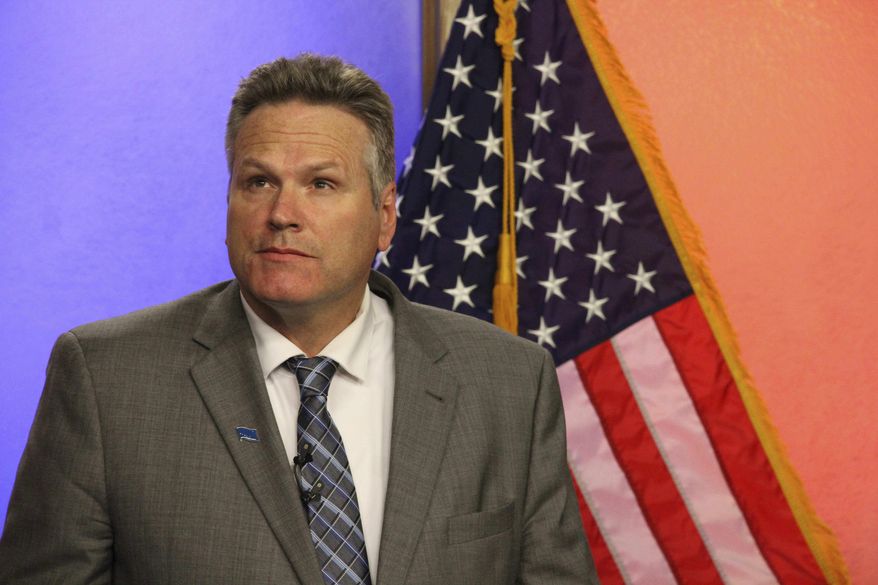 FILE - In this Oct. 25, 2018, file photo, Republican gubernatorial candidate Mike Dunleavy is shown prior to a debate with his Democratic opponent, Mark Begich, in Anchorage, Alaska. Dunleavy says he'd eliminate a $4.5 million fast-rail study from the state budget. But there's no such line item in the budget. Dunleavy, a former state senator, has campaigned on reducing state spending and limiting the growth of government. He said programs can be managed better. (AP Photo/Mark Thiessen, File)