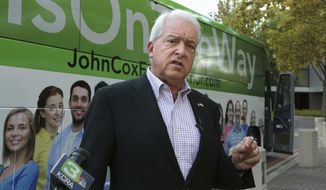 Republican gubernatorial candidate John Cox talks to reporters before beginning a statewide bus tour Thursday, Nov. 1, 2018, in Sacramento, Calif. Cox is running against Lt. Gov., Democrat Gavin Newsom in the Nov. 6 election.(AP Photo/Rich Pedroncelli)