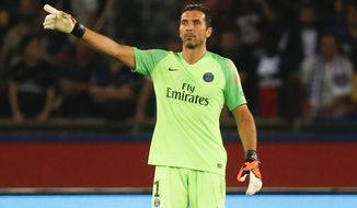 FILE - In this Sunday, Aug. 12, 2018 file photo PSG&#x27;s goalkeeper Gianluigi Buffon reacts during their League One soccer match between Paris Saint-Germain and Caen at Parc des Princes stadium in Paris. (AP Photo/Michel Euler, File)