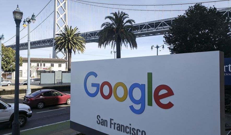 This photo shows signage outside the offices of Google in San Francisco with the San Francisco-Oakland Bay Bridge in the background, Wednesday, Oct. 31, 2018. Hundreds of Google employees are expected to temporality leave their jobs Thursday morning in a mass walkout protesting the internet company&#x27;s lenient treatment of executives accused of sexual misconduct. The San Francisco office is one of the offices that the walkout will take place. (AP Photo/Michael Liedtke)