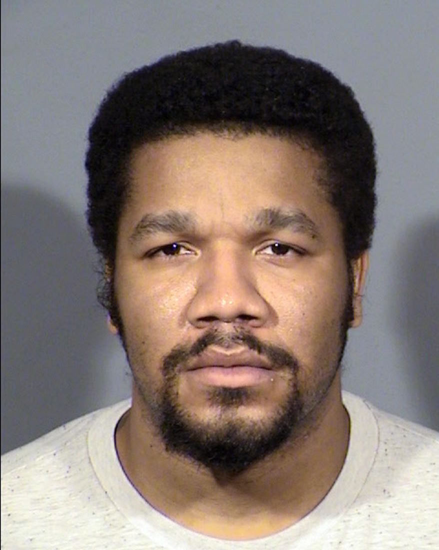 FILE--This undated Clark County Detention Center file booking photo, provided by the Las Vegas Metropolitan Police Department, shows Julius Trotter, 31. Prosecutors are considering the death penalty for Trotter, accused of killing two Vietnamese tour leaders at a Las Vegas Strip casino-hotel five months ago. (Las Vegas Metropolitan Police Department via AP, file)