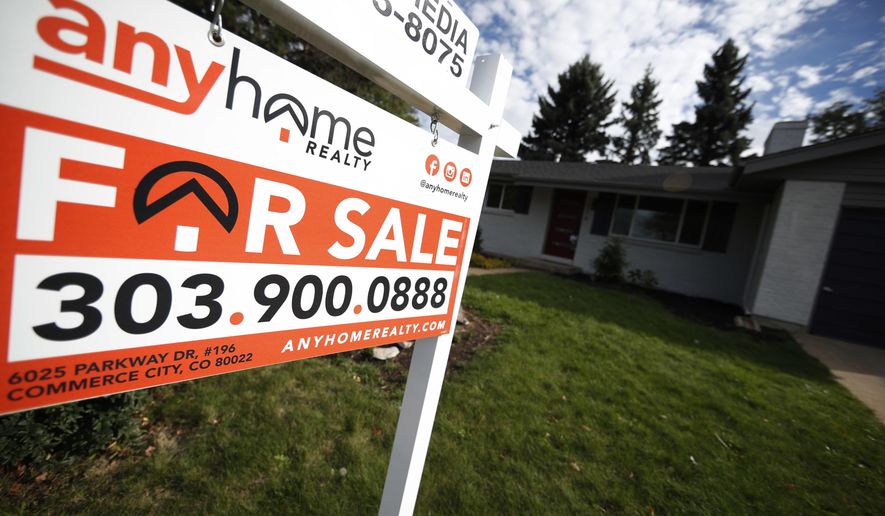 FILE- In this Oct 2, 2018, file photo a for sale sign stands outside a home on the market in the north Denver suburb of Thornton, Colo. On Thursday, Nov. 1, Freddie Mac reports on this week’s average U.S. mortgage rates. (AP Photo/David Zalubowski, File)