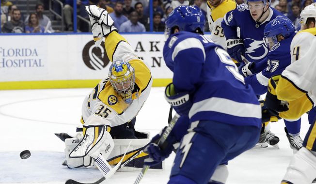 Nashville Predators goaltender Pekka Rinne (35) makes a save on a shot by Tampa Bay Lightning center Tyler Johnson (9) during the second period of an NHL hockey game Thursday, Nov. 1, 2018, in Tampa, Fla. (AP Photo/Chris O&#x27;Meara)