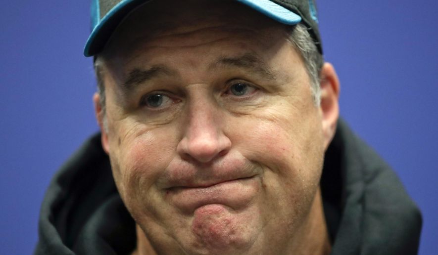 FILE- In this Sunday, Oct. 28, 2018, file photo, Jacksonville Jaguars head coach Doug Marrone grimaces during a press conference after an NFL football game against Philadelphia Eagles at Wembley stadium in London. Marrone is shouldering the blame for the team’s four-game losing streak. (AP Photo/Matt Dunham, File)