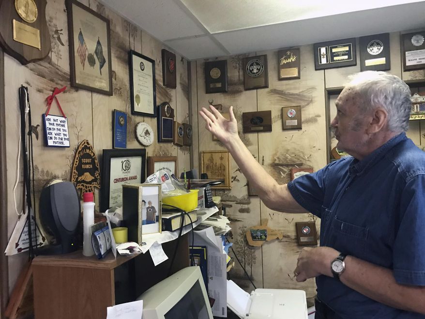 In this Oct. 16, 2018 photo, Ralph Herron keeps pieces of recognition he has earned over the years in a corner wall in his home in Fairmont, W.Va.. Ralph Herron has been involved with the Boy Scouts of America for almost his whole life. He has received organizational plaques from the Salvation Army, Boy Scouts of America and others. (Eddie Trizzino/Times-West Virginian via AP)