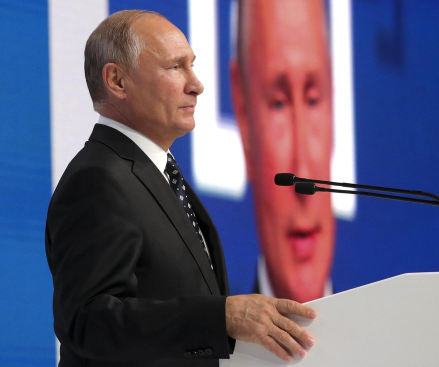 President Vladimir Putin speaks at a the community of active citizens forum in Moscow, Russia, Friday, Nov. 2, 2018 . Putin hailed the agency, saying that he highly appreciates intelligence information and analytics it provides. (Alexei Druzhinin, Sputnik, Kremlin Pool Photo via AP)
