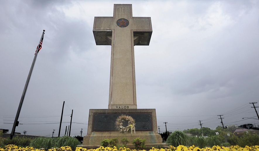 In this May 7, 2014 file photo, the World War I memorial cross is pictured in Bladensburg, Md. The Supreme Court has agreed to consider whether a nearly 100-year-old, cross-shaped war memorial located on a Maryland highway median violates the Constitution&#39;s required separation of church and state. The court announced Friday, Nov. 2, that it would hear the case. (Algerina Perna /The Baltimore Sun via AP, File)