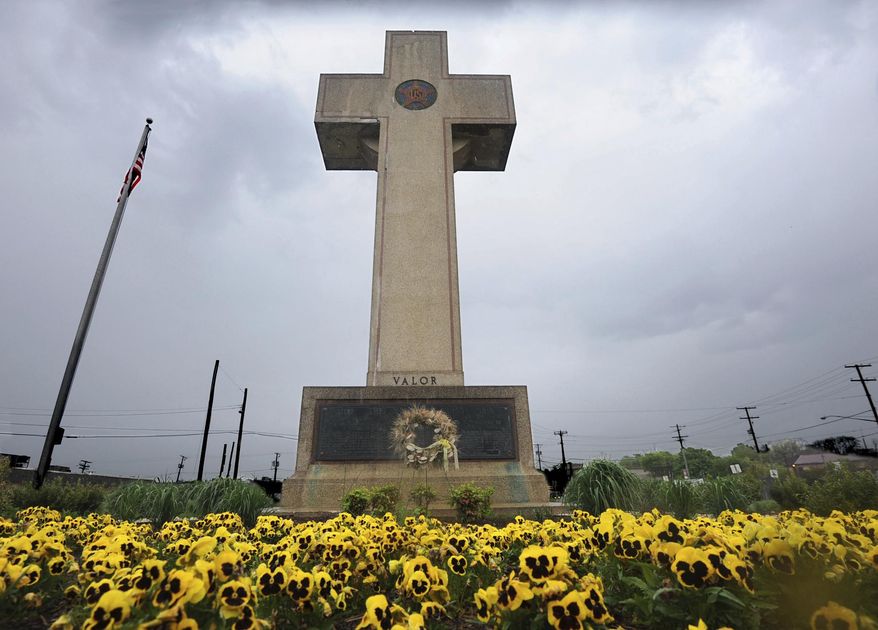 In this May 7, 2014 file photo, the World War I memorial cross is pictured in Bladensburg, Md. The Supreme Court has agreed to consider whether a nearly 100-year-old, cross-shaped war memorial located on a Maryland highway median violates the Constitution&#39;s required separation of church and state. The court announced Friday, Nov. 2, that it would hear the case. (Algerina Perna /The Baltimore Sun via AP, File)
