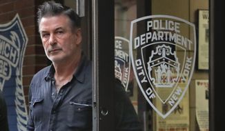 Actor Alec Baldwin walks out of the New York Police Department&#39;s 10th Precinct, Friday, Nov. 2, 2018, in New York. Baldwin was arrested Friday after allegedly punching a man in the face during a dispute over a parking spot outside his New York City home, authorities said.(AP Photo/Julie Jacobson)