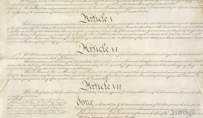 This photo made available by the U.S. National Archives shows a portion of the United States Constitution with Articles V-VII. For the past two centuries, constitutional amendments have originated in Congress, where they need the support of two-thirds of both houses, and then the approval of at least three-quarters of the states. But under a never-used second prong of Article V, amendments can originate in the states. (National Archives via AP)