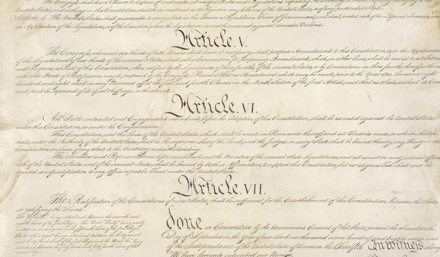 This photo made available by the U.S. National Archives shows a portion of the United States Constitution with Articles V-VII. For the past two centuries, constitutional amendments have originated in Congress, where they need the support of two-thirds of both houses, and then the approval of at least three-quarters of the states. But under a never-used second prong of Article V, amendments can originate in the states. (National Archives via AP)