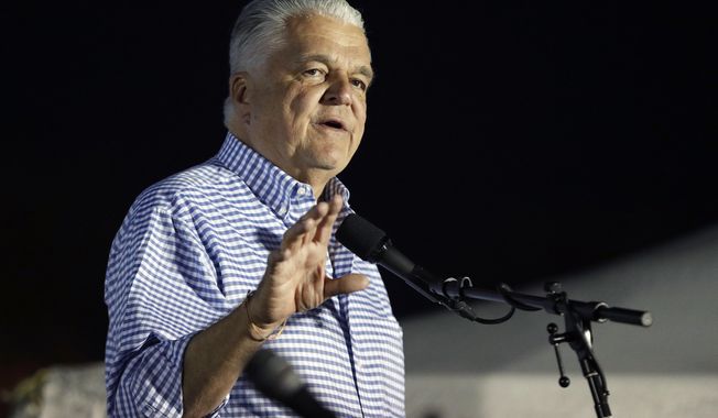 Clark County Commission Chair and Democratic gubernatorial candidate Steve Sisolak speaks at a rally Friday, Nov. 2, 2018, in Las Vegas. (AP Photo/John Locher)