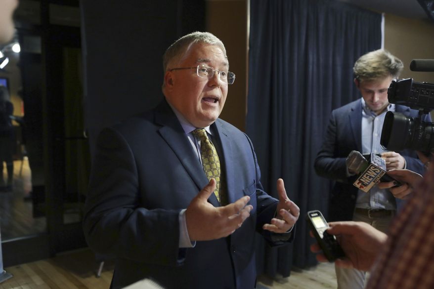 In this Nov. 1, 2018 photo, Patrick Morrisey speaks to reporters after a debate with incumbent Sen. Joe Manchin in Morgantown, W.Va. Republicans have a huge advantage as they seek to hold or expand their 51-49 Senate majority, with the battle for control running mostly through states that President Donald Trump won in 2016.   (AP Photo/Raymond Thompson)