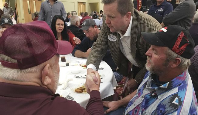 In this Oct. 25, 2018 photo, Virginia Senate candidate Corey Stewart speaks with members of the Virginia Deer Hunters Association in Chesterfield County, Va. Stewart started his U.S. Senate bid a last year as a longshot, promising to run a “vicious” and “ruthless” crusade his opponent in a style similar to President Donald Trump’s successful 2016 race.  With just days until Election Day, there’s little sign those Trump-like tactics have found purchase in an increasingly blue state.  (AP Photo/Alan Suderman)