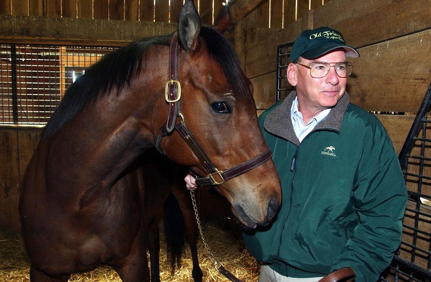FILE - In this April 6, 2004 file photo, Michael Blowen prepares to take Rich in Dallas out of his stall on Afton farm near Midway, Ky., Rich in Dallas was one of the horses that played Seabiscuit in the film of the same title. Blowen is the founder of Old Friends, a new nonprofit organization devoted to providing a retirement home for thoroughbred stallions and other racehorses when their careers have ended. (AP Photo/James Crisp, File)