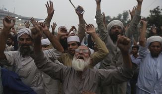 Protesters shout slogans during a rally to condemn a Supreme Court decision that acquitted Asia Bibi, a Christian woman, who spent eight years on death row accused of blasphemy, in Lahore, Pakistan, Friday, Nov. 2, 2018. The release of Bibi was apparently delayed Friday after talks failed between the government and radical Islamists who want her publicly hanged. (AP Photo/K.M. Chaudary)