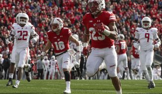 Wisconsin&#39;s Jonathan Taylor runs for a touchdown during the second half of an NCAA college football game against Rutgers Saturday, Nov. 3, 2018, in Madison, Wis. (AP Photo/Morry Gash)