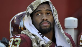 Washington Redskins defensive end Jonathan Allen sits on the bench in the last two minutes of an NFL football game against the Atlanta Falcons, Sunday, Nov. 4, 2018, in Landover, Md. (AP Photo/Mark Tenally)